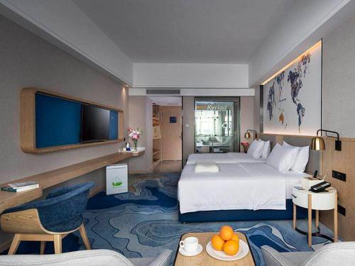 Imagen de la habitación del Hotel Kyriad Marvelous Zhongshan Nanlang Center. Foto 12