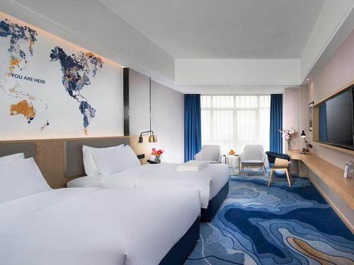 Imagen de la habitación del Hotel Kyriad Marvelous Zhongshan Nanlang Center. Foto 13