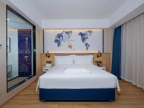 Imagen de la habitación del Hotel Kyriad Marvelous Zhongshan West District. Foto 13