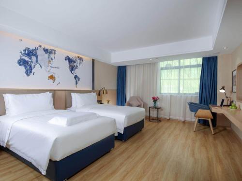 Imagen de la habitación del Hotel Kyriad Marvelous Zhongshan West District. Foto 14