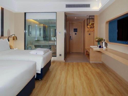 Imagen de la habitación del Hotel Kyriad Marvelous Zhongshan West District. Foto 18