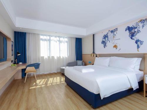 Imagen de la habitación del Hotel Kyriad Marvelous Zhongshan West District. Foto 19