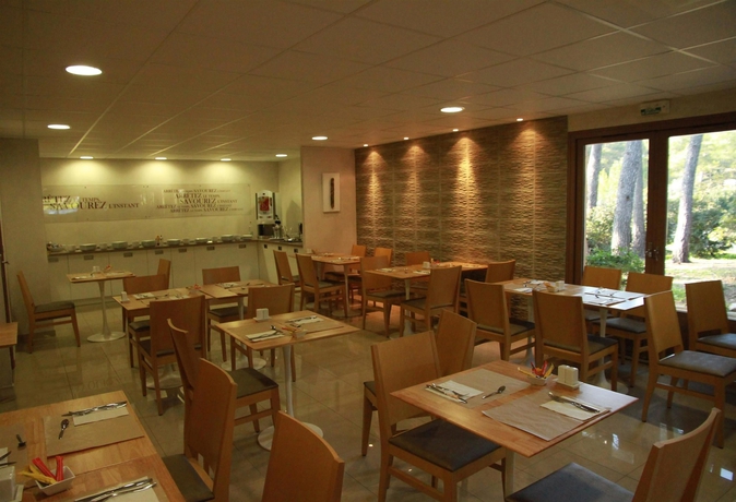 Imagen del bar/restaurante del Hotel Kyriad Montpellier Nord - Parc Euromédecine. Foto 2