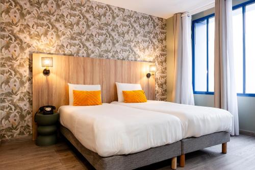 Imagen de la habitación del Hotel Kyriad Paris 10 Canal Saint Martin. Foto 16