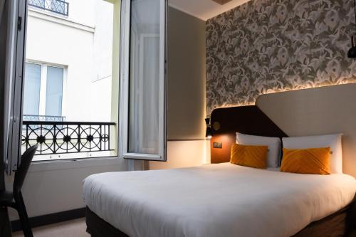 Imagen de la habitación del Hotel Kyriad Paris 10 Canal Saint Martin. Foto 18
