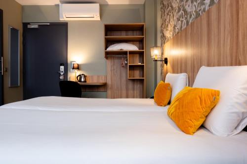 Imagen de la habitación del Hotel Kyriad Paris 10 Canal Saint Martin. Foto 20
