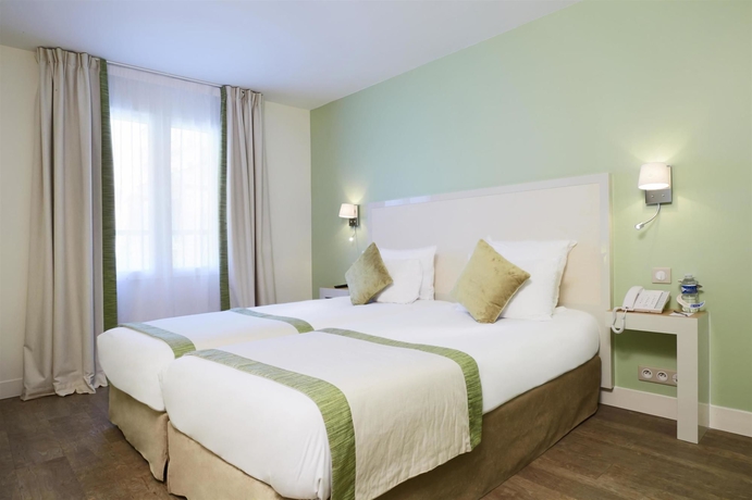 Imagen de la habitación del Hotel Kyriad Paris 18 - Porte de Clignancourt. Foto 10