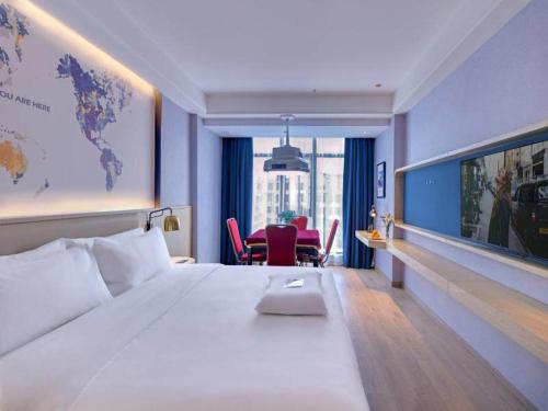 Imagen de la habitación del Hotel Kyriad Pingxiang Wanlong Bay Branch. Foto 14