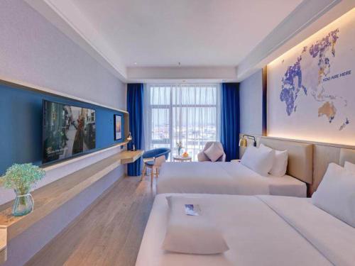 Imagen de la habitación del Hotel Kyriad Pingxiang Wanlong Bay Branch. Foto 18