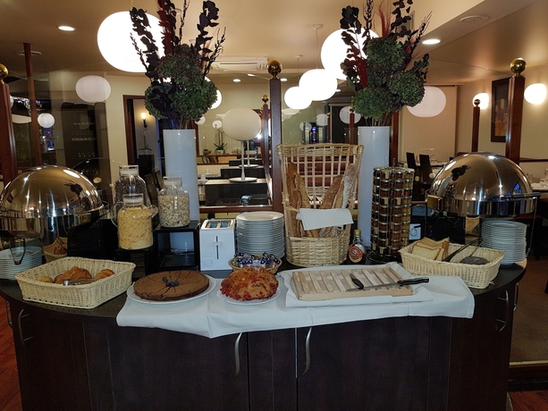 Imagen del bar/restaurante del Hotel Kyriad Prestige Clermont-ferrand. Foto 2