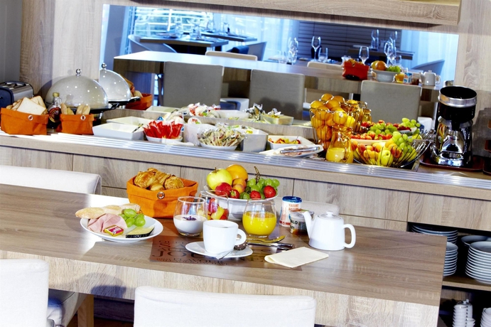 Imagen del bar/restaurante del Hotel Kyriad Prestige Vannes Centre - Palais Des Arts. Foto 2