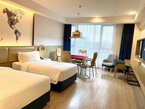 Imagen de la habitación del Hotel Kyriad Shenzhen Pingdi Low Carbon City. Foto 13