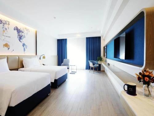 Imagen de la habitación del Hotel Kyriad Shenzhen Pingdi Low Carbon City. Foto 14