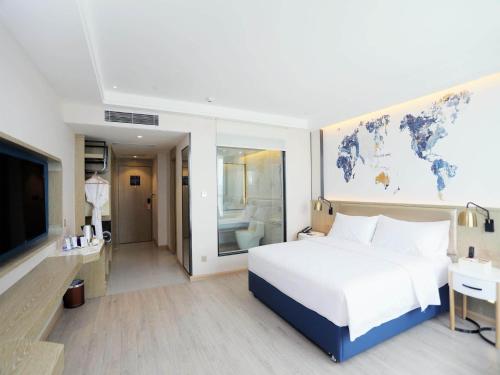 Imagen de la habitación del Hotel Kyriad Shenzhen Pingdi Low Carbon City. Foto 16