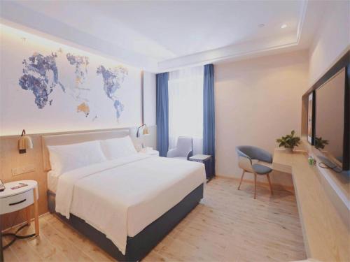 Imagen de la habitación del Hotel Kyriad Shenzhen Pingdi Low Carbon City. Foto 17