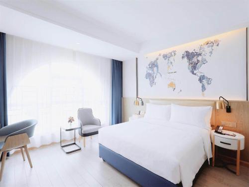 Imagen de la habitación del Hotel Kyriad Shenzhen Pingdi Low Carbon City. Foto 18
