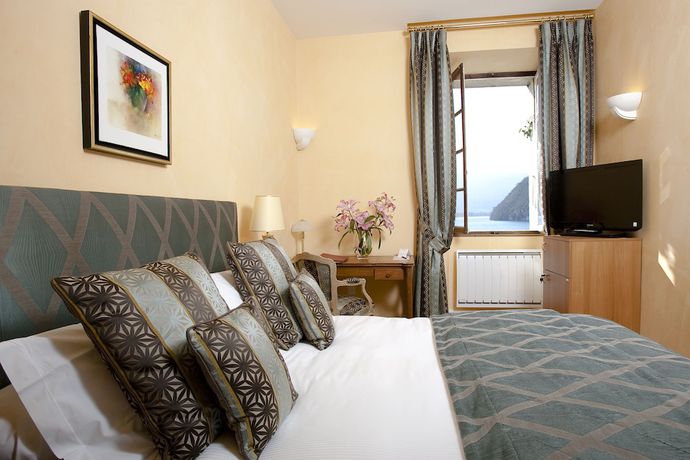 Imagen de la habitación del Hotel L Abbaye De Talloires. Foto 5