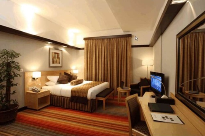 Imagen de la habitación del Hotel L' Arabia Apartments. Foto 16