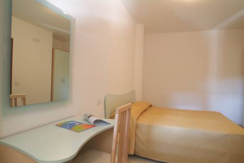 Imagen de la habitación del Hotel L' Arcobaleno Resort. Foto 8