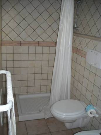 Imagen de la habitación del Hotel L' Arcobaleno Resort. Foto 11