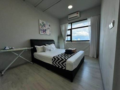 Imagen de la habitación del Hotel L Homestay JesseltonQuay JQ KK City亚庇市区中心民宿2房1厕. Foto 15