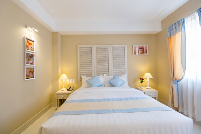 Imagen de la habitación del Hotel L Odeon Phu My Hung. Foto 10