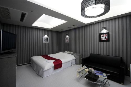 Imagen de la habitación del Hotel LALA minato - Adult Only. Foto 6