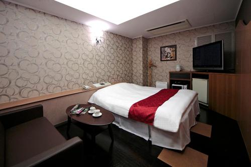 Imagen de la habitación del Hotel LALA minato - Adult Only. Foto 7