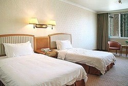 Imagen de la habitación del Hotel LAO DI FANG. Foto 3