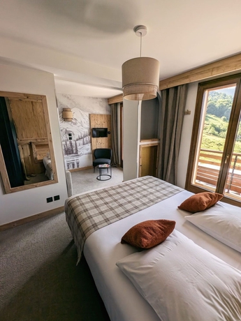 Imagen de la habitación del Hotel L\'Auberge Ensoleill&eacute;e. Foto 16