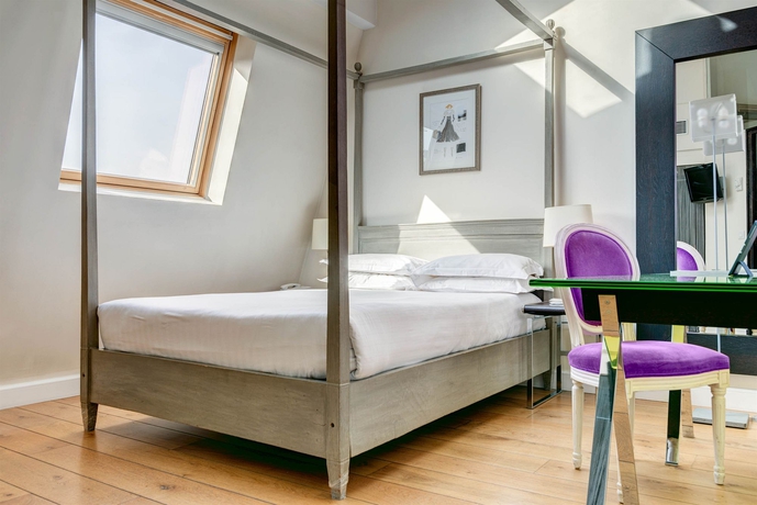 Imagen de la habitación del Hotel LE 123 ELYSEES. Foto 11