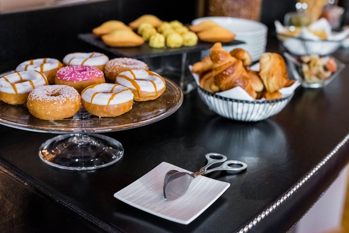 Imagen del bar/restaurante del Hotel LE 123 ELYSEES. Foto 3