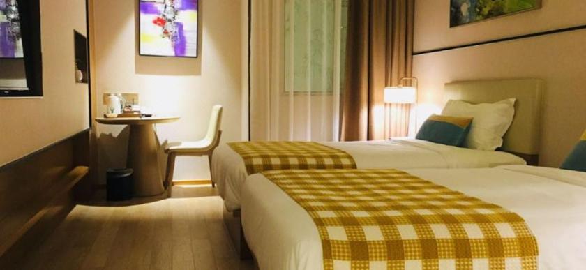 Imagen de la habitación del Hotel LEON HOTEL (TIANZIFANG). Foto 9