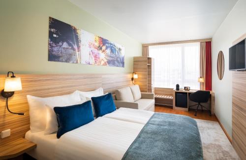 Imagen de la habitación del Hotel LEONARDO SALZBURG AIRPORT. Foto 20