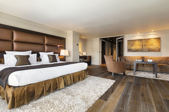 Imagen de la habitación del Hotel LES SUITES DE LA POTINIERE. Foto 5