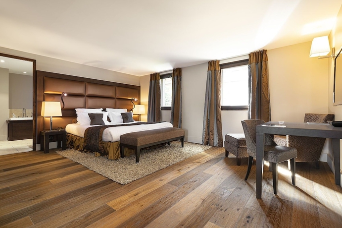 Imagen de la habitación del Hotel LES SUITES DE LA POTINIERE. Foto 12