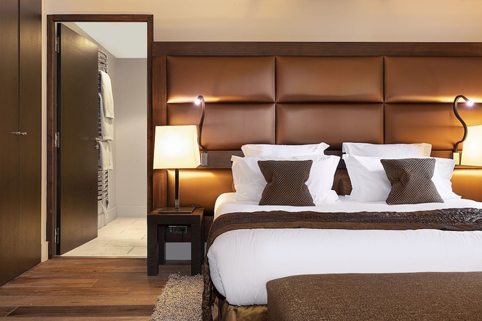 Imagen de la habitación del Hotel LES SUITES DE LA POTINIERE. Foto 17