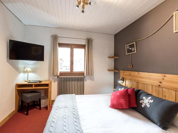 Imagen de la habitación del Hotel L'Ecureuil. Foto 8