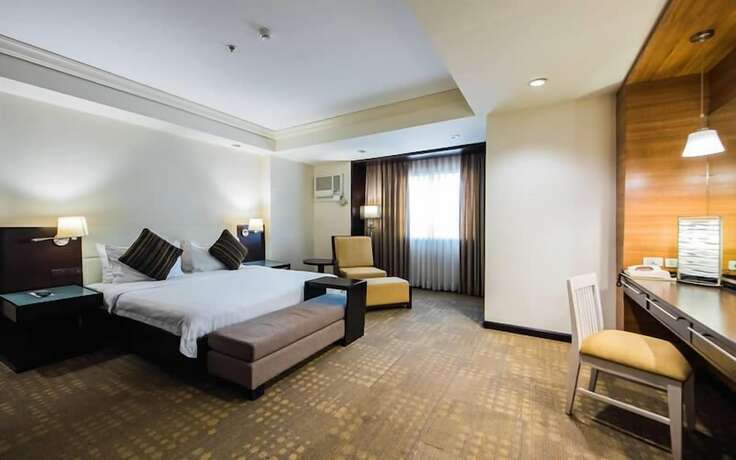 Imagen de la habitación del Hotel L'Fisher Ecotel. Foto 17