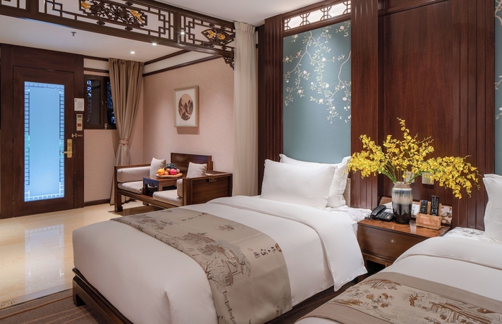 Imagen de la habitación del Hotel LIJIANG DUOFU RESORT HOTEL. Foto 10