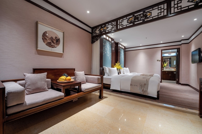 Imagen de la habitación del Hotel LIJIANG DUOFU RESORT HOTEL. Foto 11