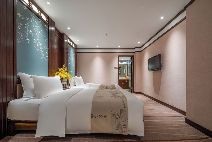 Imagen de la habitación del Hotel LIJIANG DUOFU RESORT HOTEL. Foto 13