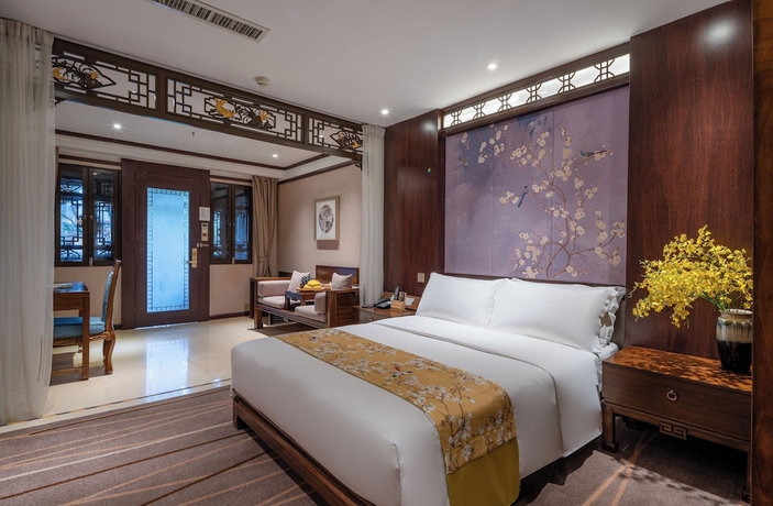 Imagen de la habitación del Hotel LIJIANG DUOFU RESORT HOTEL. Foto 14