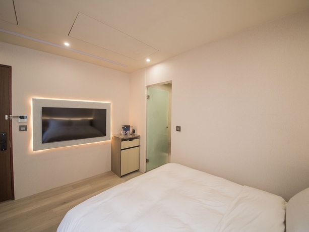 Imagen de la habitación del Hotel LIVIN, Jiaoxi. Foto 11