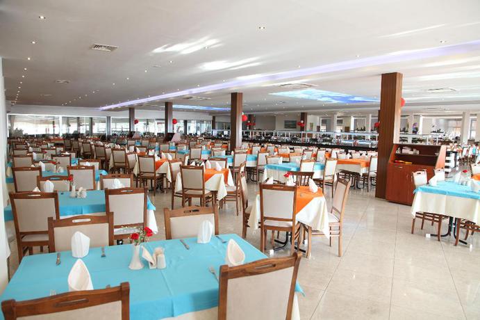 Imagen del bar/restaurante del Hotel LONICERA WORLD. Foto 9