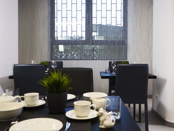 Imagen del bar/restaurante del Hotel LOTO BUSINESS HOTEL. Foto 3