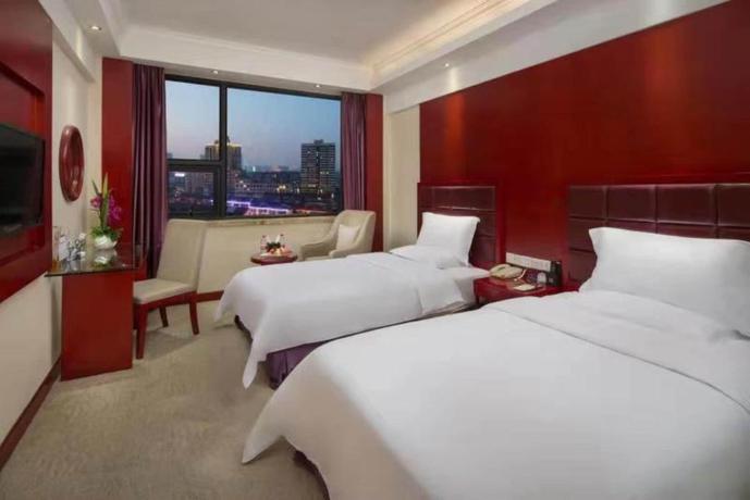 Imagen de la habitación del Hotel LOTUS HUATIAN HOTEL. Foto 4
