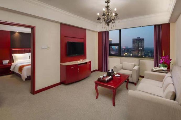 Imagen de la habitación del Hotel LOTUS HUATIAN HOTEL. Foto 5