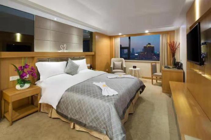 Imagen de la habitación del Hotel LOTUS HUATIAN HOTEL. Foto 6