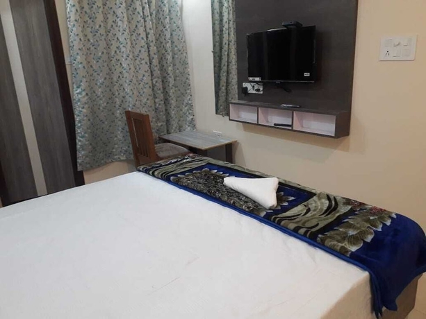 Imagen de la habitación del Hotel LS Grand Guest House. Foto 11